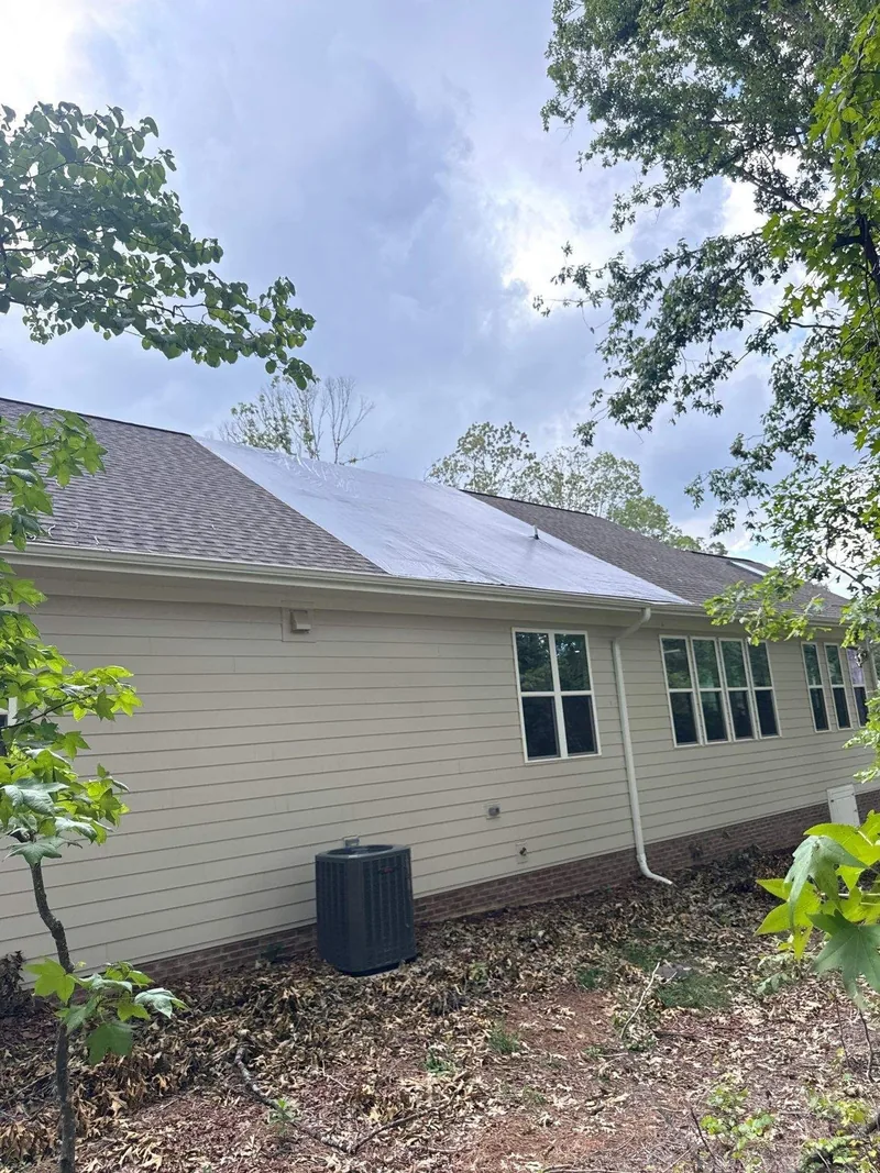 A roofline and elevation documented on an exterior claim